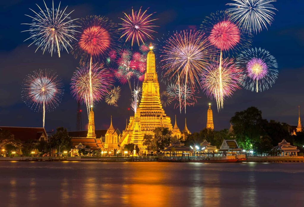 Wat Arun river side with Beautiful Fireworks for celebration at twilight time in Bangkok, Thailand